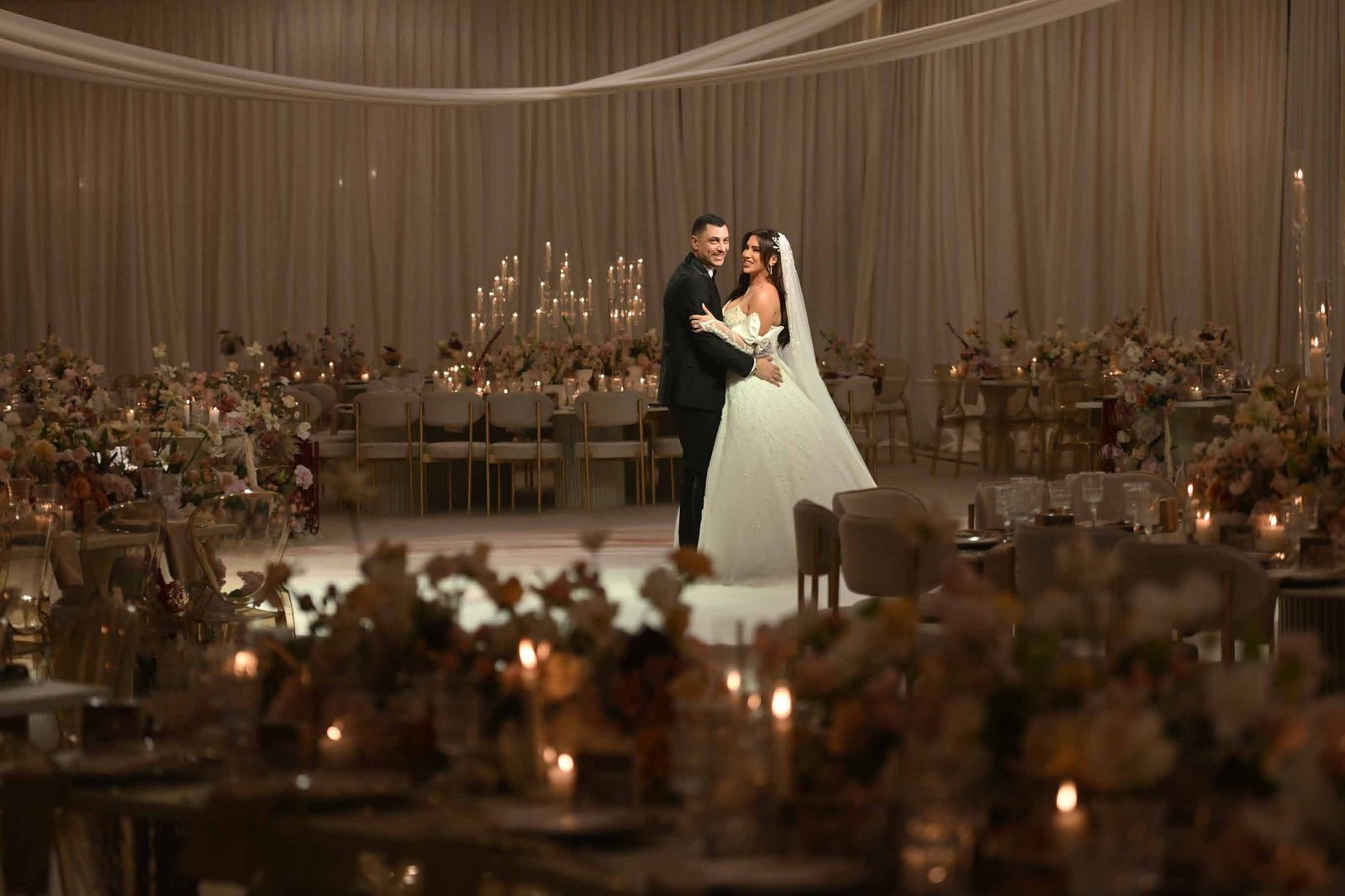 Candlelit staircase leading to the amber-lit reception tables
