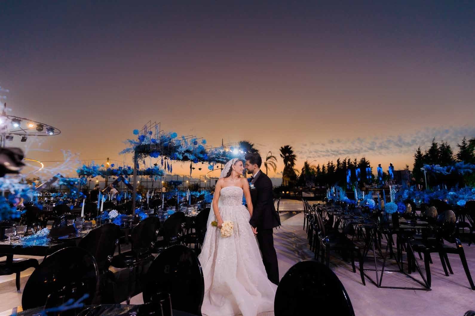 Sapphire floral installation over the reception tables at sunset