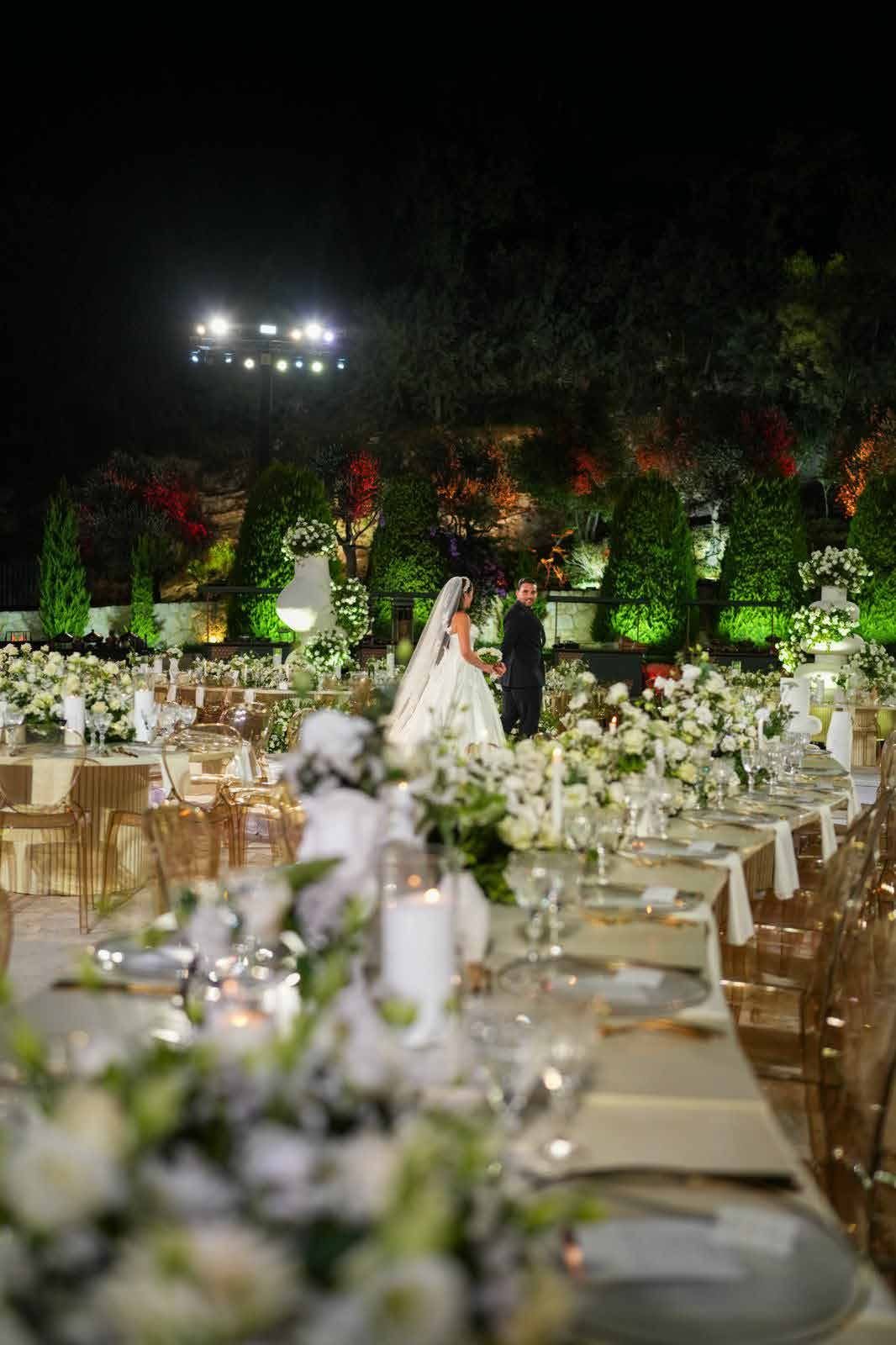 Aerial view of the green, string-lit garden reception