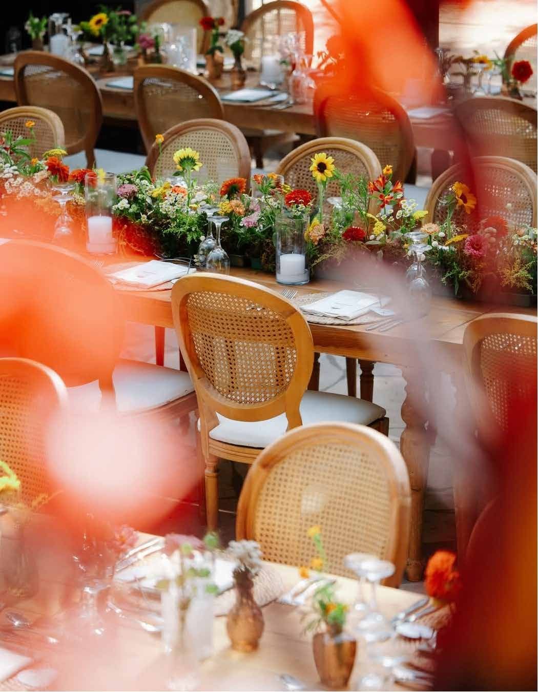 Candlelit staircase leading toward the reception at dusk