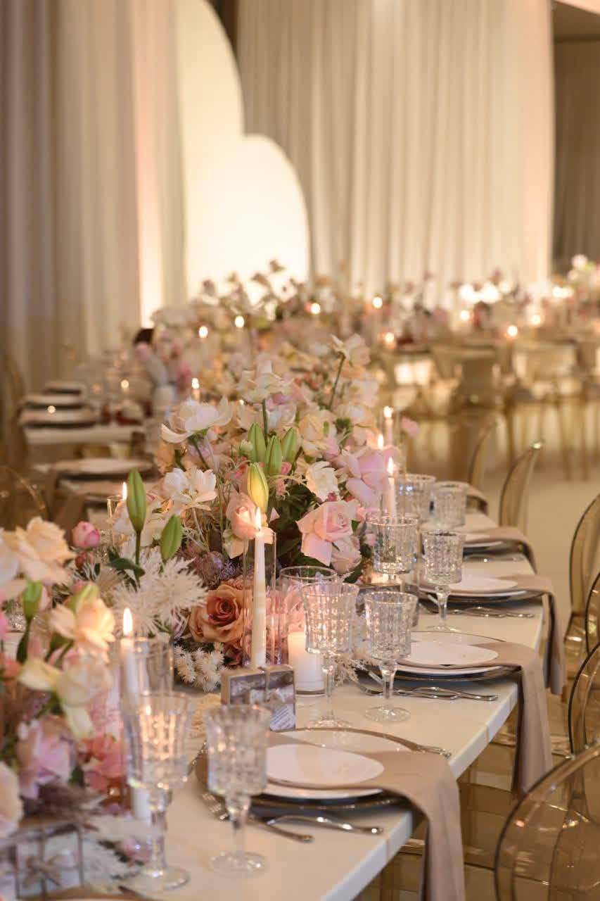 Blush floral and lantern detail on the reception table