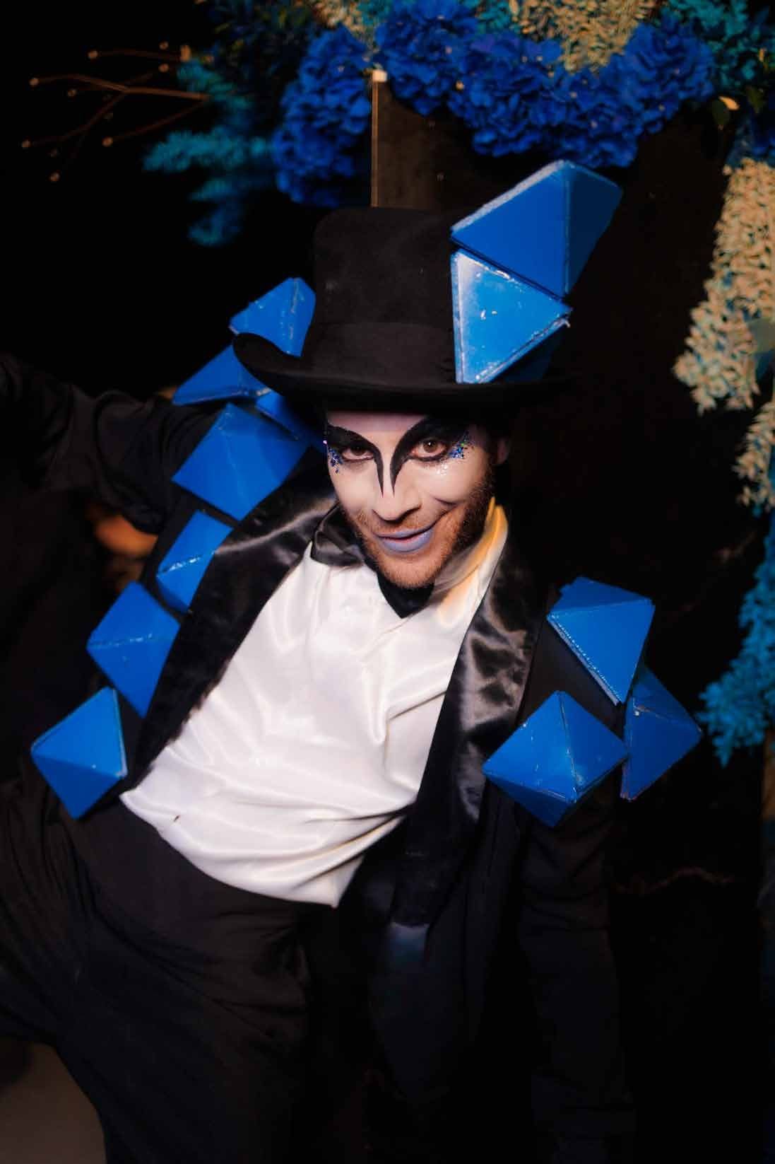 Entertainer performing in geometric blue costume